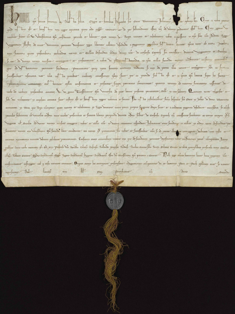 Das Bild zeigt eine Urkunde, an der am unteren Rand ein Siegel befestigt ist.
