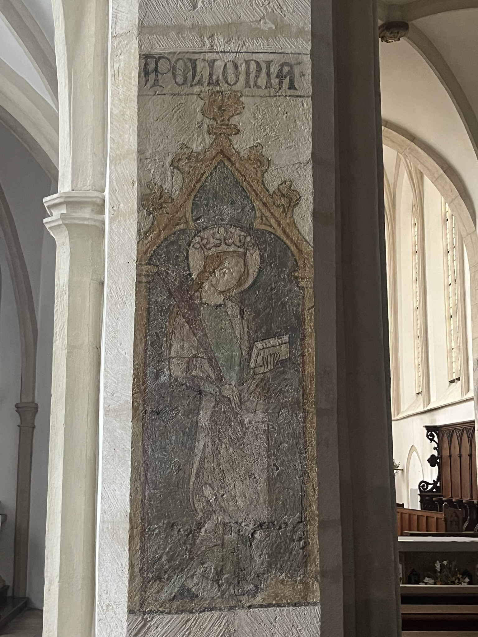 Das Bild zeigt ein Fresco in der Kirche St. Ägid von der Heiligen Apollonia.